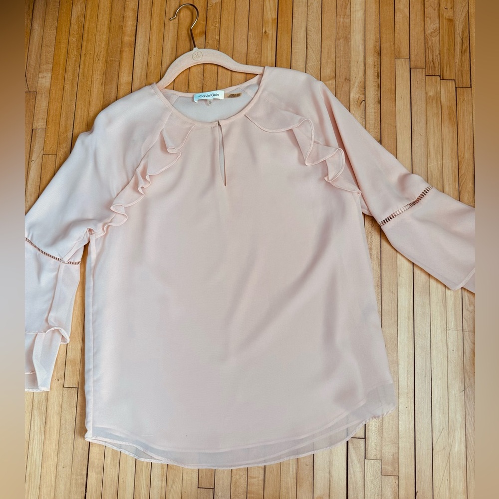 Calvin Klein light pink blouse with ruffled sleeves size xs.